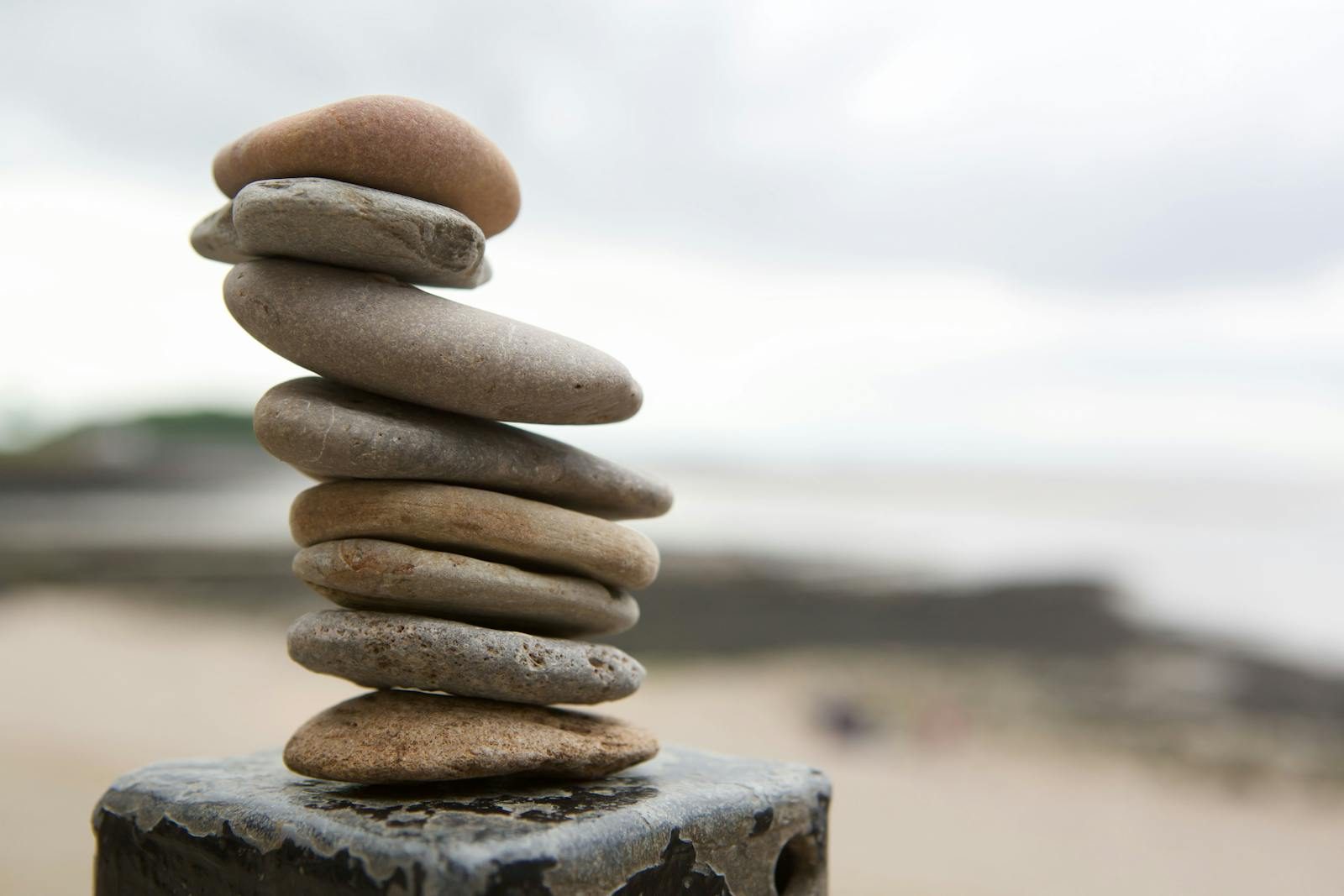 A serene composition of stacked stones on an English beach, symbolizing balance.